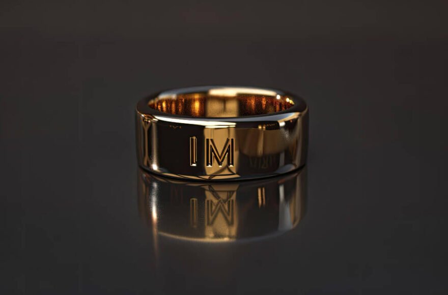 Gold wedding ring engraved with IM, symbolizing marriage, identity, and loss after divorce