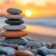 Stacked stones at sunset symbolizing balance and the grief journey timeline